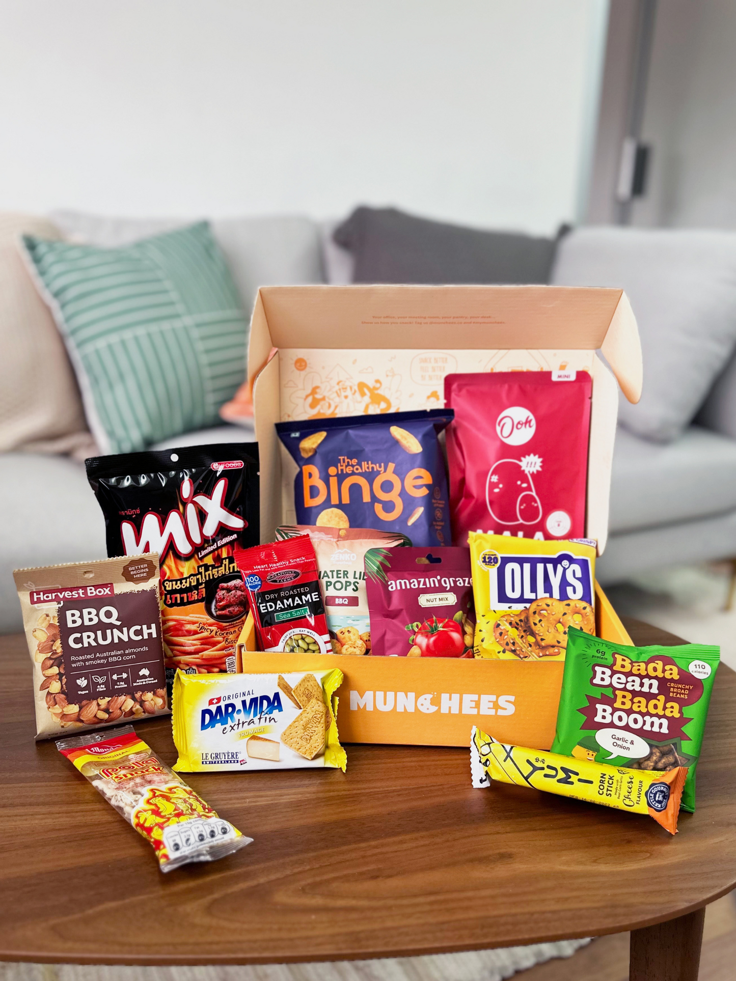 the savoury box snack (in front of sofa) for office pantry snack and corporate gifting